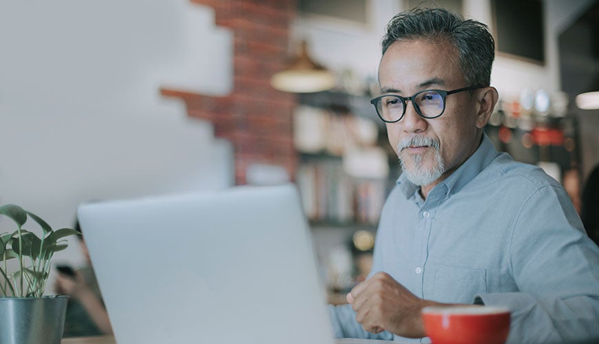 Older man working on computer