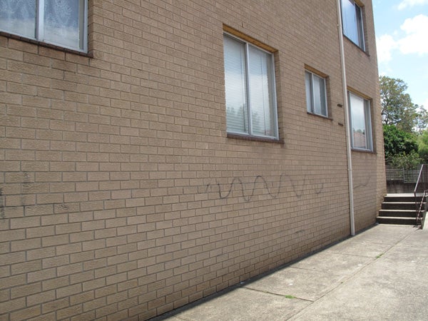 External view, flat occupied by family in community detention.