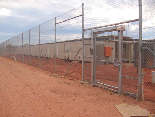 Looking into Curtin IDC through perimeter fence