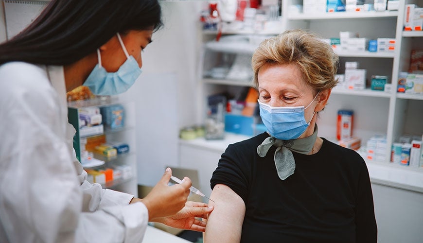 Nurse giving COVID vaccination