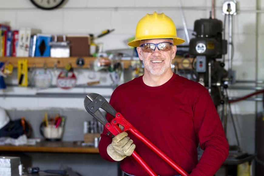 Older white man in a workshop