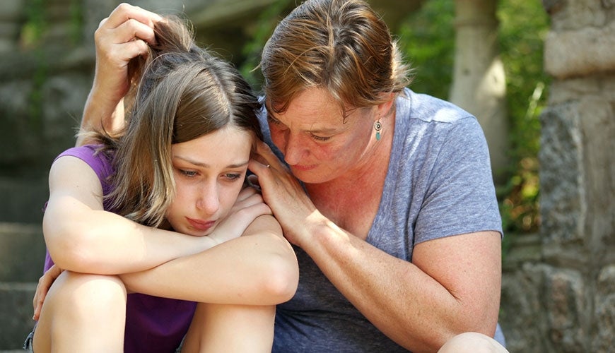 parent consoling sad child