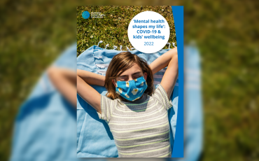 cover photo for report - girl with mask laying in the sun outside