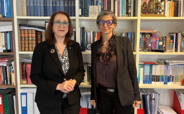 Commission President Emeritus Professor Rosalind Croucher AM, a woman wearing glasses and a black suit, standing next to Francesca Albanese, the United Nations Special Rapporteur on the situation of human rights in the Palestinian Territory occupied since 1967, a woman wearing a black suit and glasses.