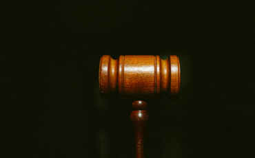 Photo of a judge's gavel on a black background