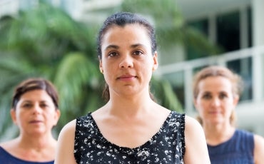 Young woman with older women in background