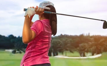 woman playing golf