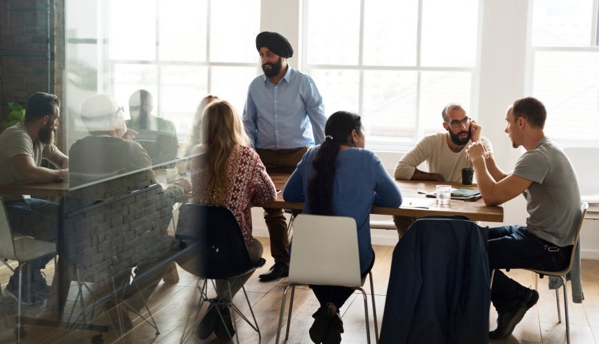 Diverse group of business people in meeting.