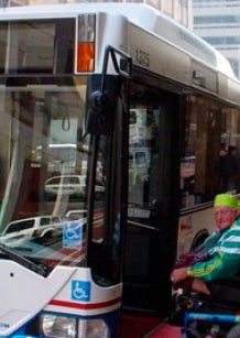 Paralympian and PWD NSW member Mr Alan Sargent boards an accessible bus