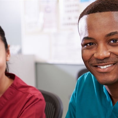 Female and male nurses smiling