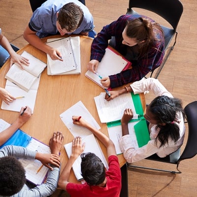 overhead photo of students working on assignment