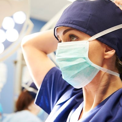 Doctor wearing mask in operating theatre