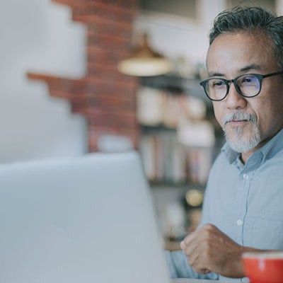 Older man working on computer