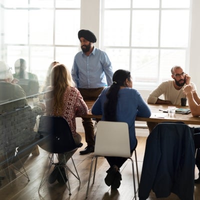 Diverse group of business people in meeting.